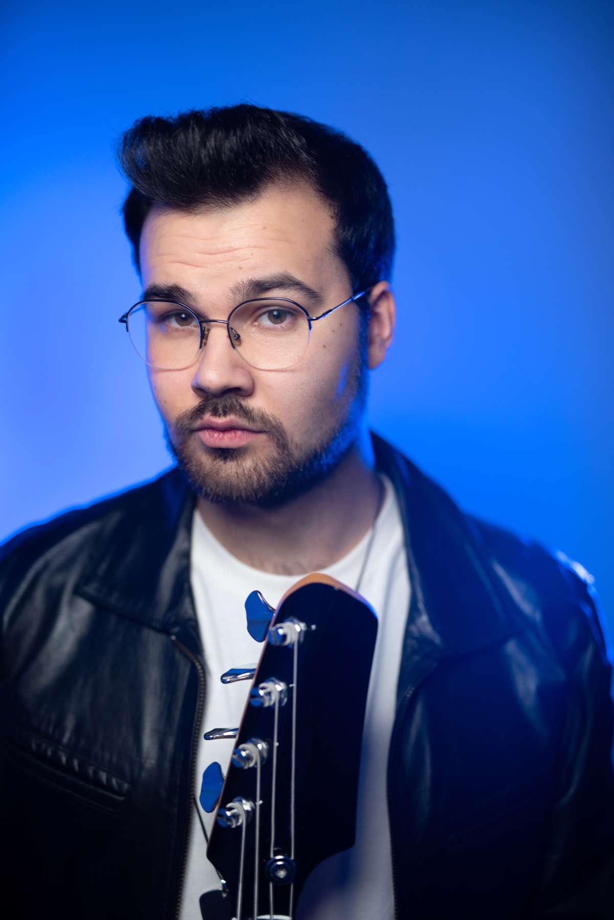 Portrait of Robbie D. Carpenter with bass guitar